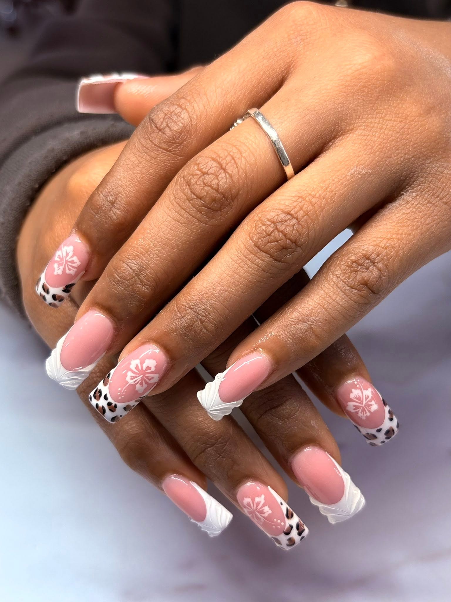 White sculpted tips with floral and leopard details